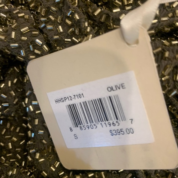 Haute Hippie mini Skirt
Olive and Gold
Bead Embellishments
Zip Closure - Picture 3 of 3